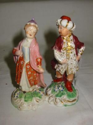 Appraisal: A PAIR OF DERBY PORCELAIN FIGURES modelled as a lady