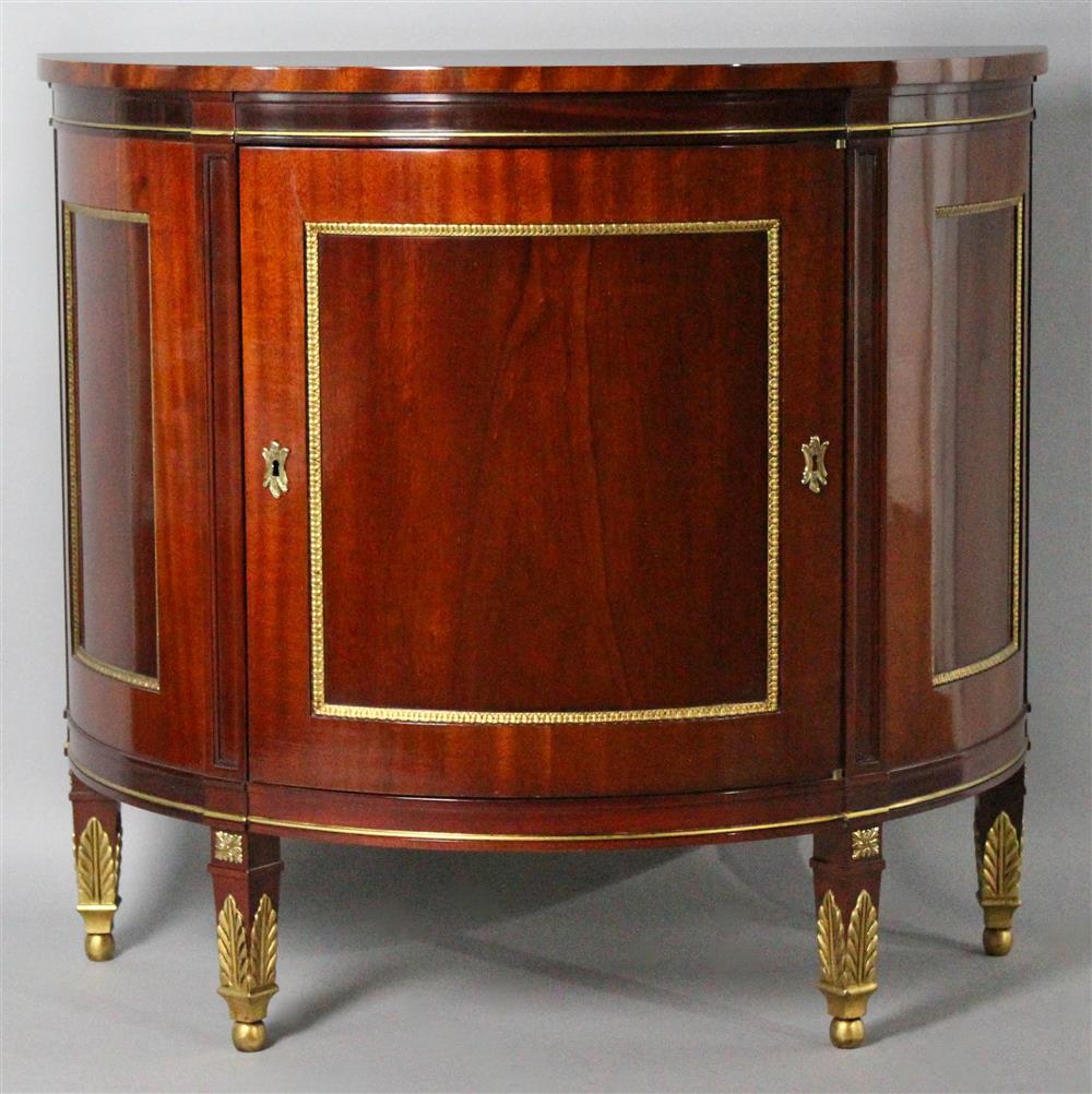 Appraisal: KINDEL FRENCH EMPIRE STYLE DEMILUNE MAHOGANY COMMODE WITH INLAY molded