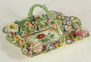 Appraisal: English porcelain flower encrusted dessert basket English porcelain flower encrusted