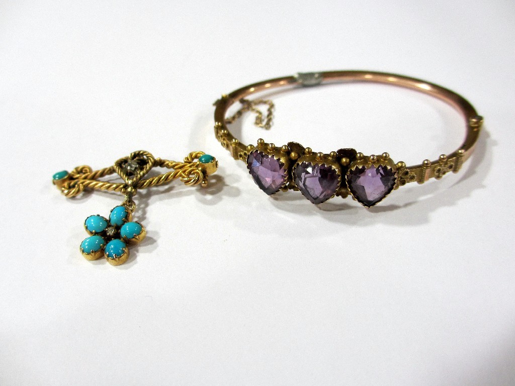 Appraisal: A Victorian gold bangle set with three heart shaped amethysts