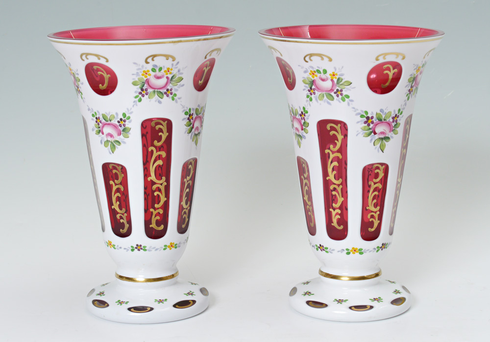 Appraisal: PAIR BOHEMIAN CUT TO CRANBERRY VASES Flared rim cased glass