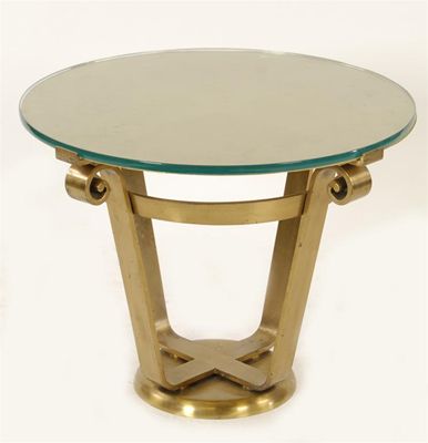 Appraisal: An Art Deco brass occasional table circular section with four