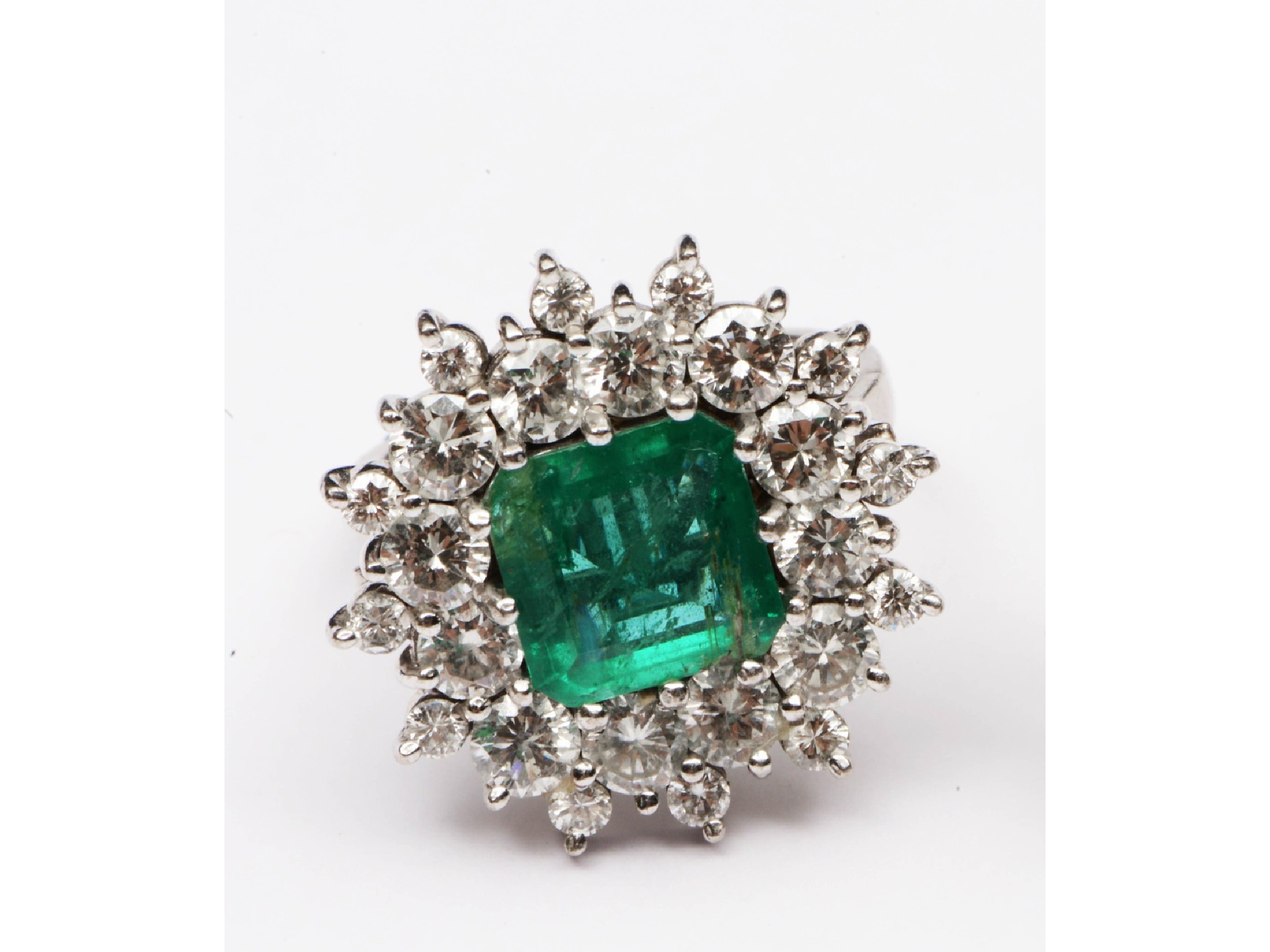 Appraisal: An emerald and diamond dress ring centred with an untested