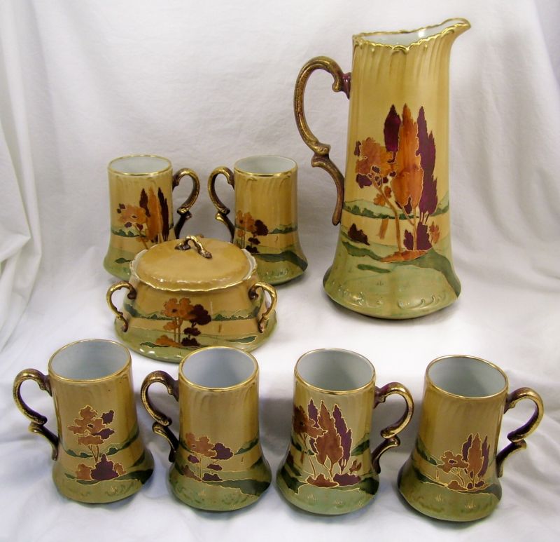 Appraisal: Dolton Art Tankard Set Set includes Tall tankard measures high