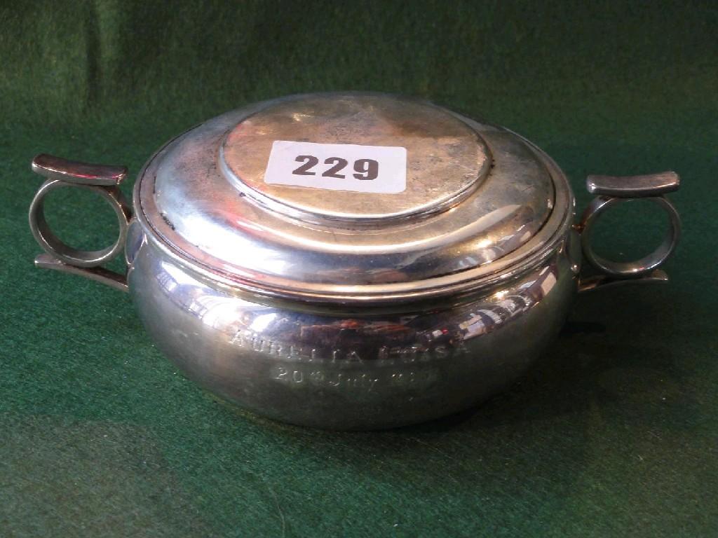 Appraisal: A silver lidded porringer of circular squat form with two