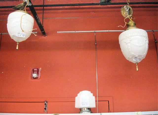 Appraisal: Glass and Gilt Metal Deco Style Chandeliers From an East