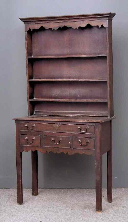 Appraisal: An th Century oak lowboy the later open dresser top