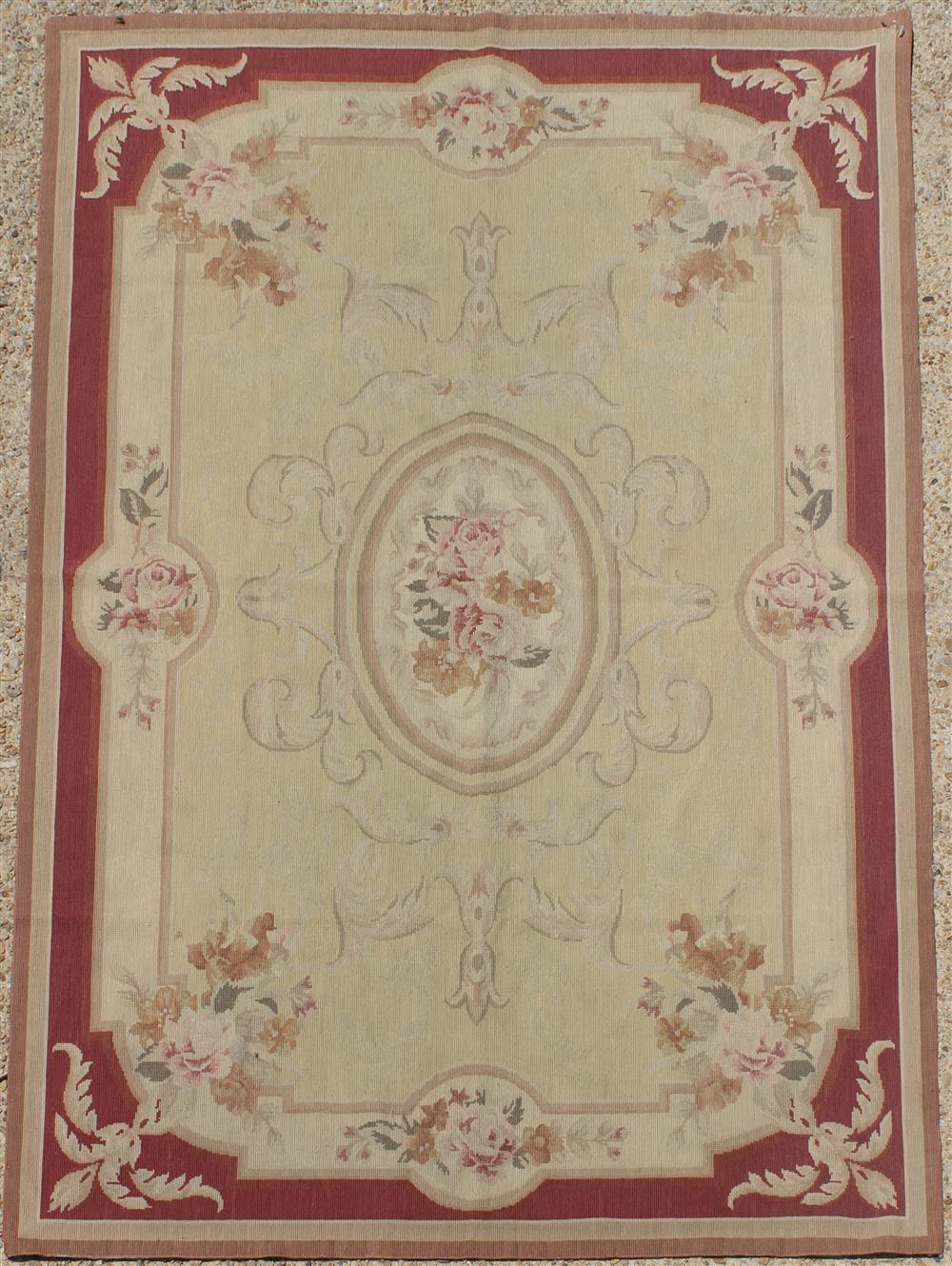 Appraisal: NEEDLEPOINT WOOL RUG IN THE AUBUSSON TASTE colors are muted