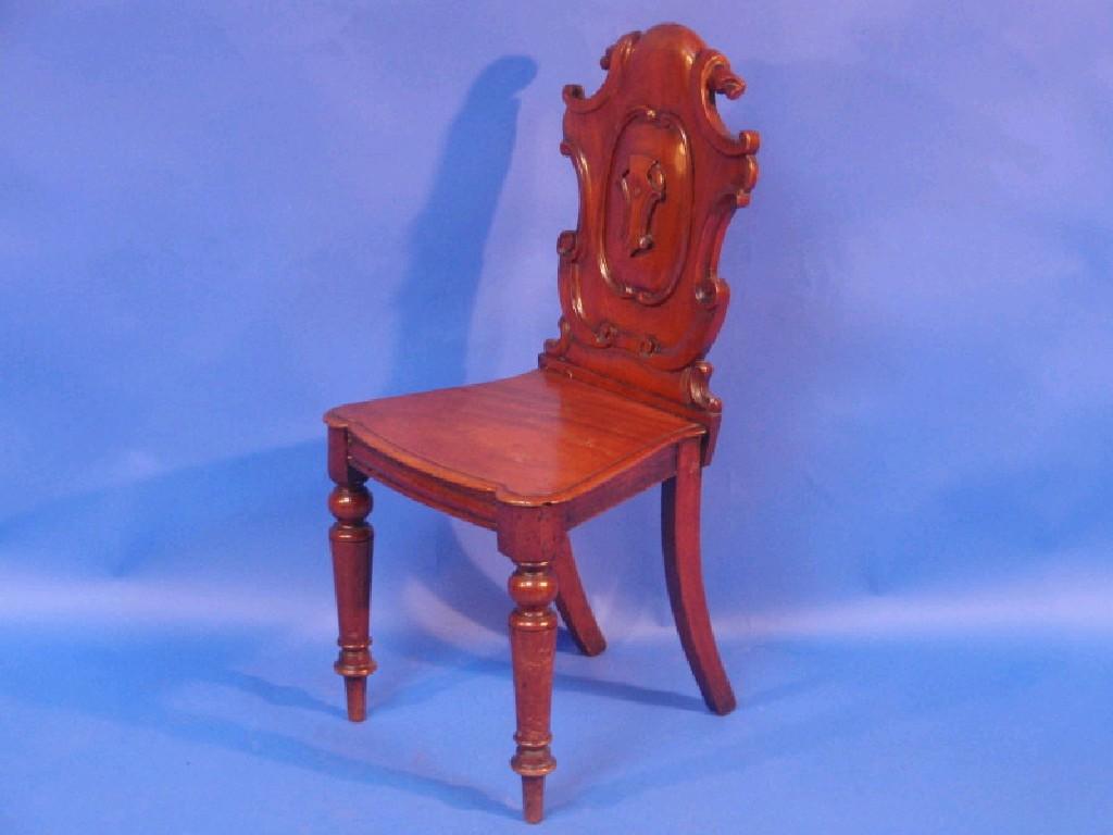 Appraisal: A Victorian mahogany shield back hall chair with a panel