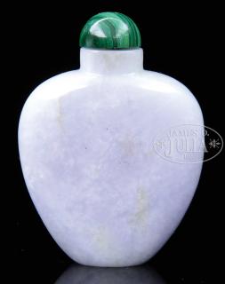 Appraisal: CARVED JADEITE SNUFF BOTTLE th century China The bottle carved