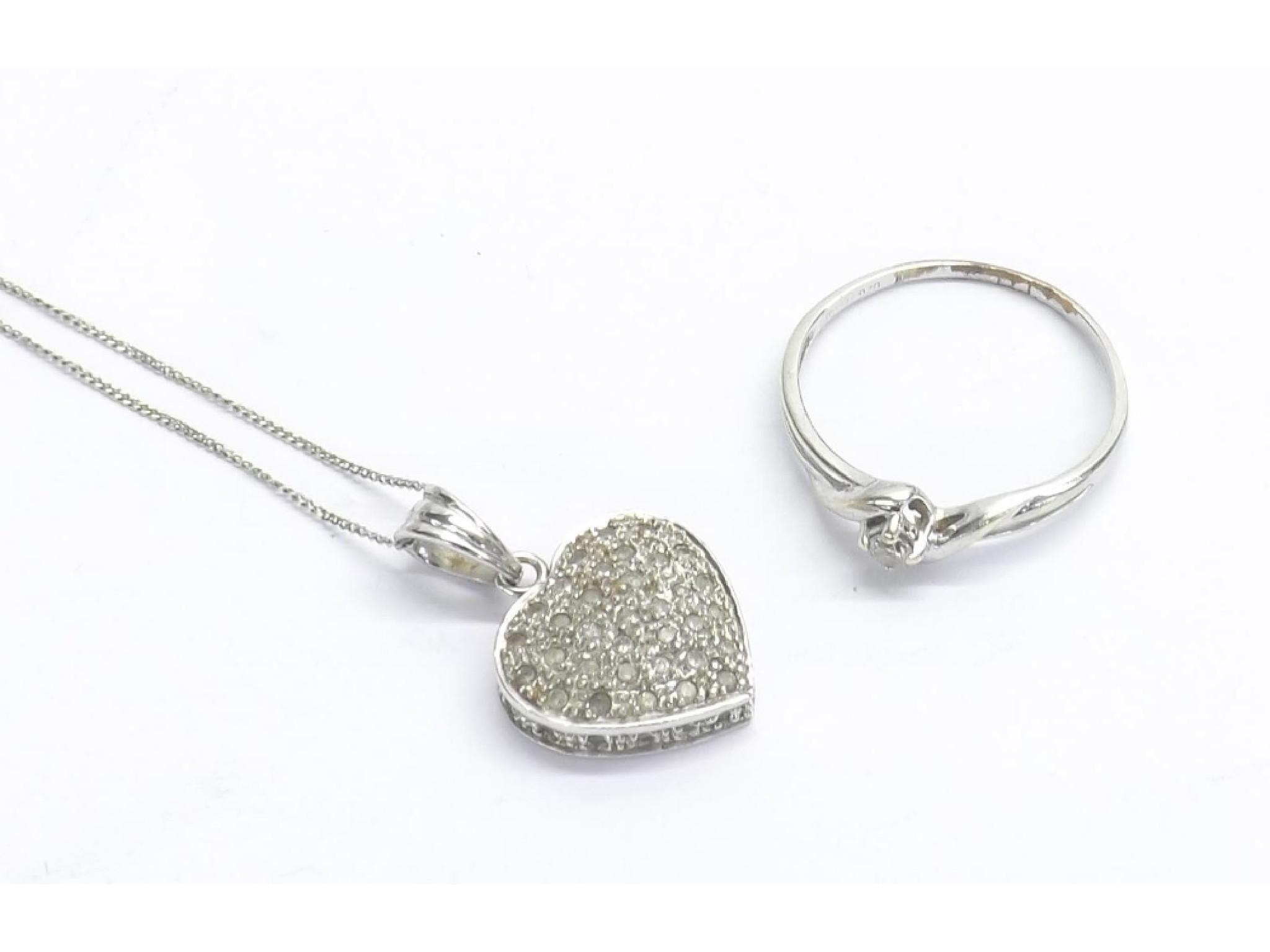 Appraisal: ct pav diamond set white gold heart pendant on a