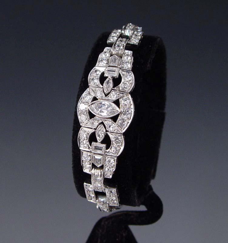 Appraisal: PLATINUM RETRO DECO DIAMOND BELLY BRACELET Platinum bracelet contains seventy