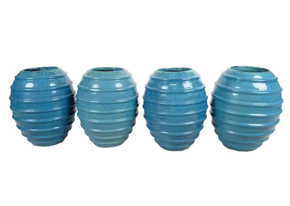 Appraisal: SET OF FOUR BLUE-GLAZED EARTHENWARE RIBBED POTScontemporary unsigned blue flambe