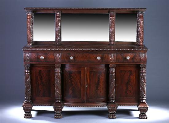 Appraisal: EMPIRE STYLE CARVED MAHOGANY SIDEBOARD late th century Mirrored step-back