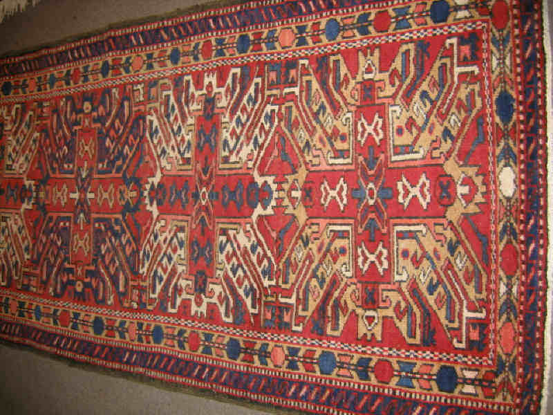 Appraisal: CHELABERD DESIGN LONG RUG The red field shows an allover