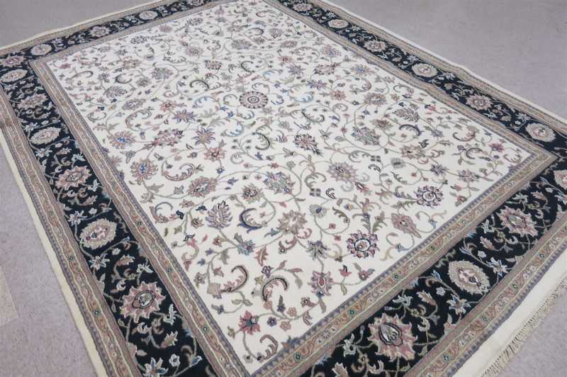 Appraisal: HAND KNOTTED ORIENTAL CARPET Indo-Persian Isfahan floral design on cream