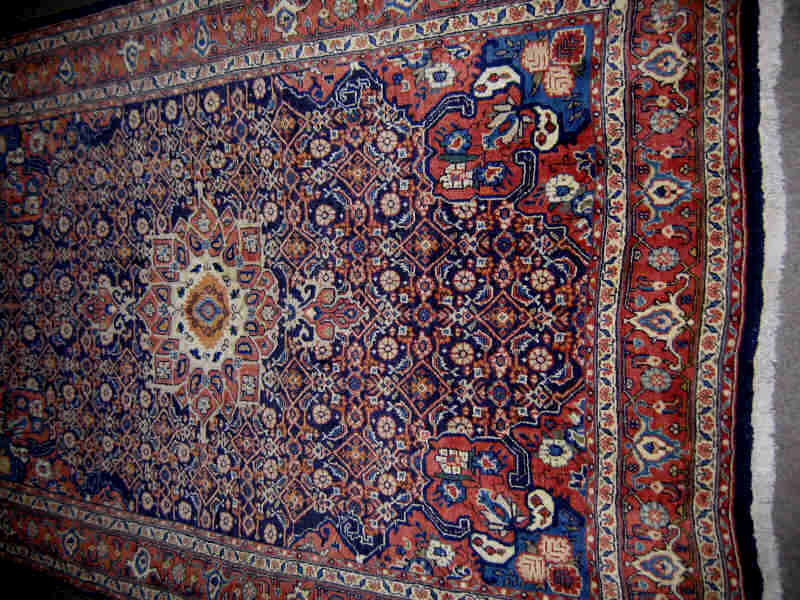 Appraisal: MID TH CENTURY BIJAR THROW RUG The indigo herati field