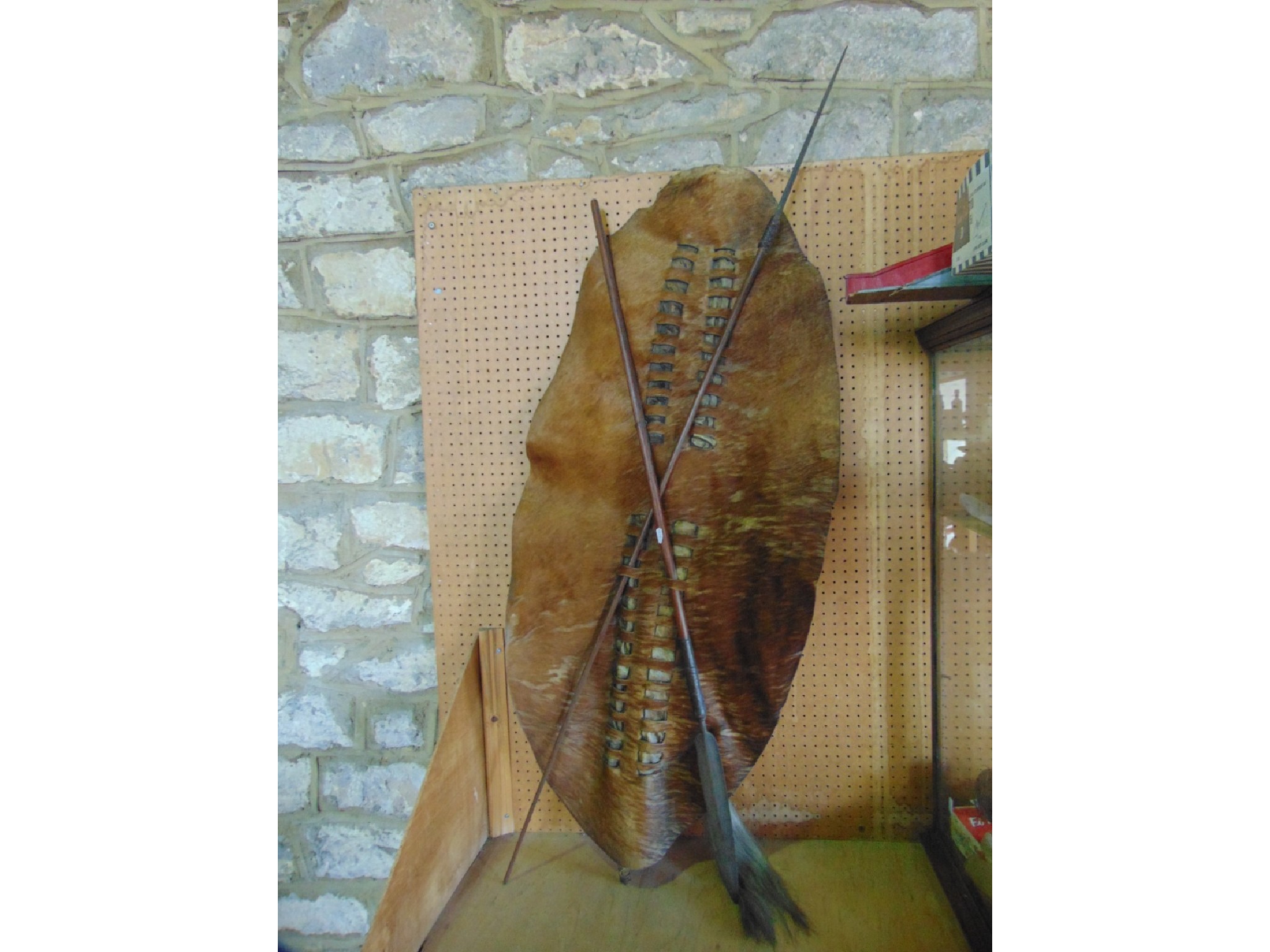 Appraisal: A Zulu type hide shield of oval form presented with