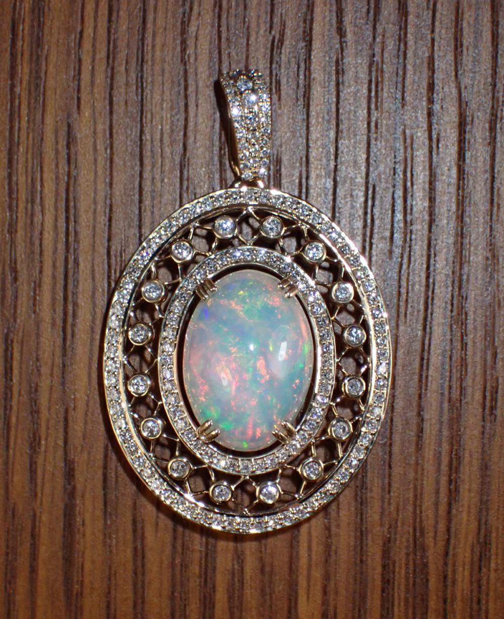 Appraisal: OPAL DIAMOND AND FOURTEEN KARAT GOLD PENDANT The large k