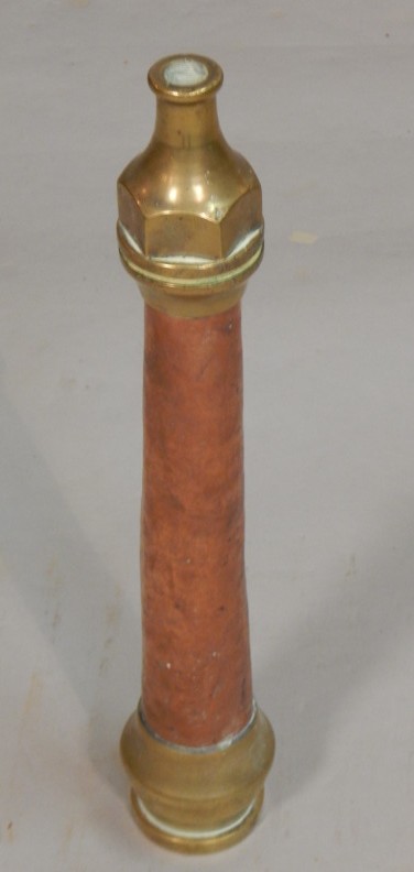 Appraisal: A copper and brass fireman's hose nozzle stamped McGregor Dundee