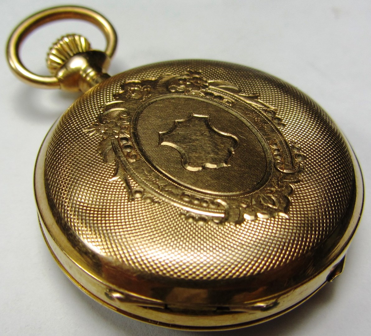 Appraisal: A ladies gold cased keyless wind openfaced fob watch with