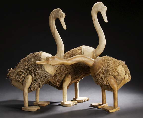 Appraisal: Trio of Large Geese modeled of wood and palm tree