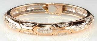 Appraisal: A K GOLD AND DIAMOND BANGLE BRACELET The hinged bangle