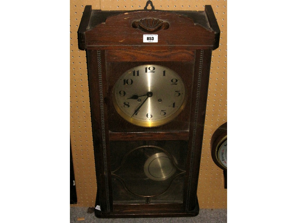 Appraisal: Edwardian oak cased wall clock