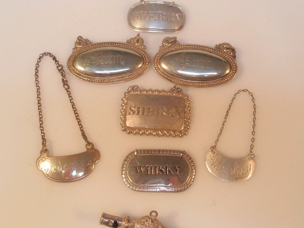 Appraisal: Small silver and plated spirit labels