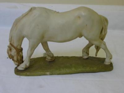 Appraisal: A ROYAL DUX FIGURE OF A HORSE modelled grazing and