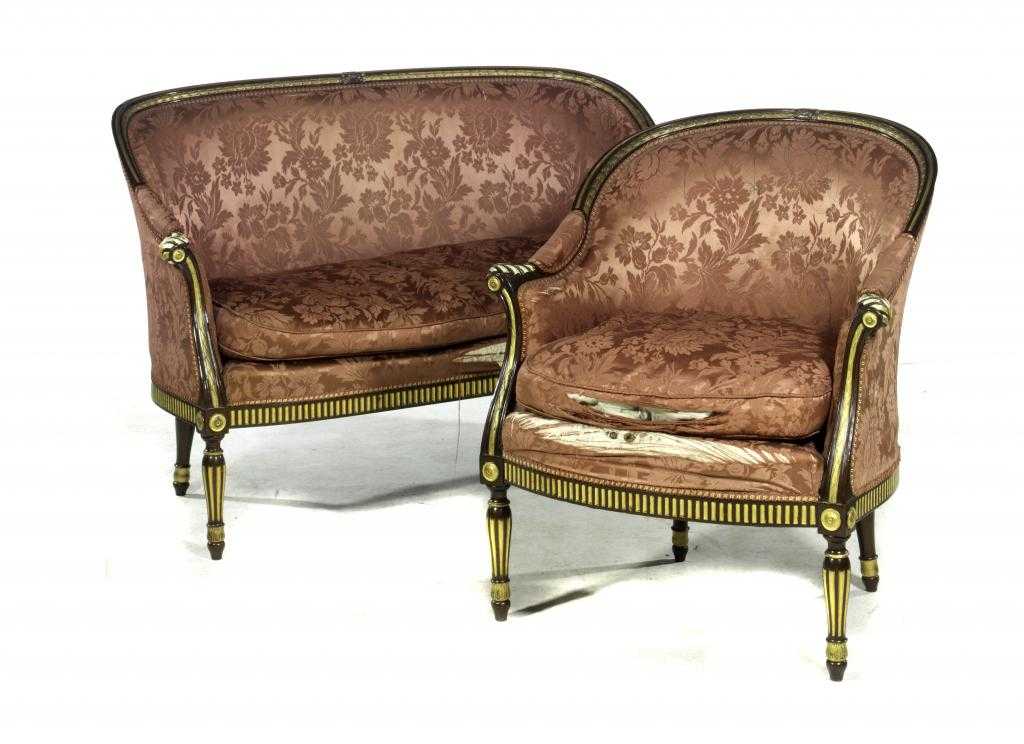 Appraisal: A PARCEL GILT MAHOGANY SOFA AND ARMCHAIR the channelled rail