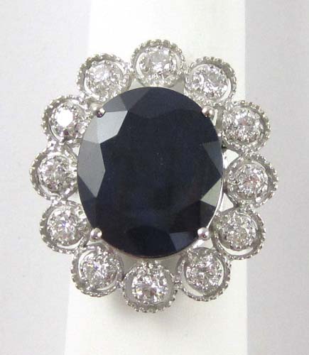 Appraisal: SAPPHIRE DIAMOND AND FOURTEEN KARAT GOLD RING The large white