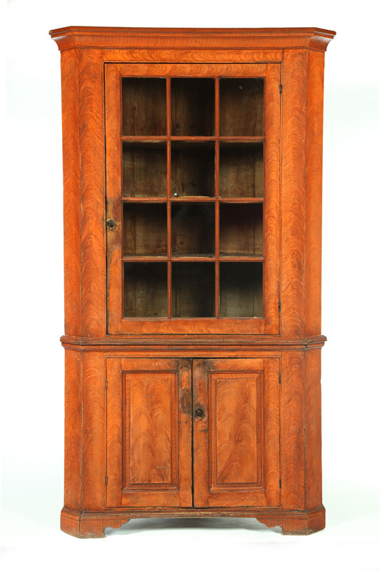 Appraisal: DECORATED CORNER CUPBOARD Probably Pennsylvania - pine Two-piece cupboard the