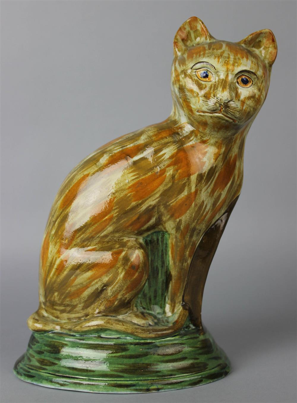 Appraisal: STAFFORDSHIRE PEARLWARE MODEL OF A CAT late th early th