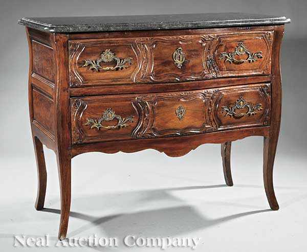 Appraisal: A French Provincial Carved Walnut Commode th c grey marble