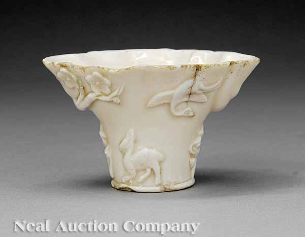 Appraisal: A Chinese Blanc-de-Chine Libation Cup probably Kangxi - molded to