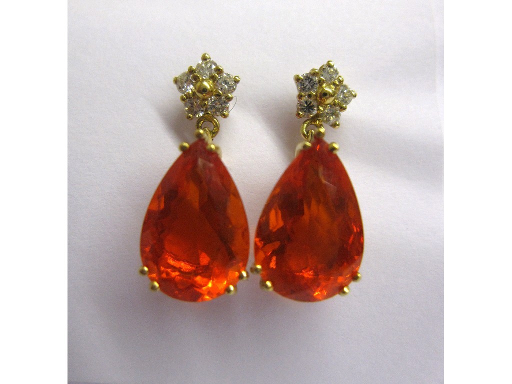 Appraisal: Eighteen carat gold mounted fire opal and diamond earrings with