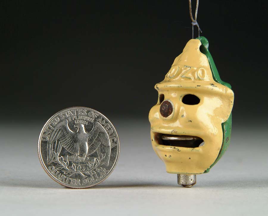 Appraisal: BOZO GREEN TOY CAP BOMB BOMB Manufacturer unknown Circa Enameled