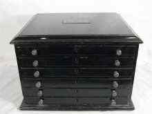 Appraisal: A six drawer ebonised jeweller's cabinet each drawer subdivided for