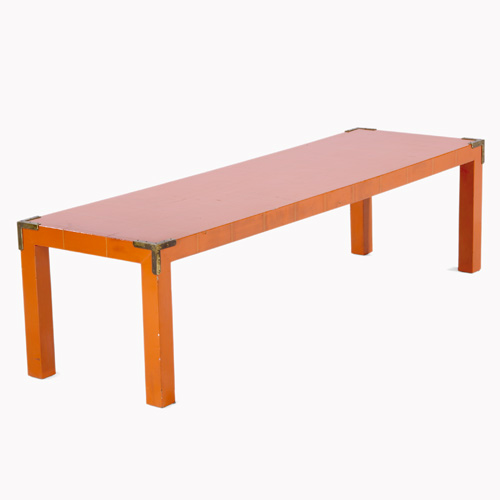 Appraisal: TOMMI PARZINGER CHARAK Rectangular coffee table covered in orange vinyl