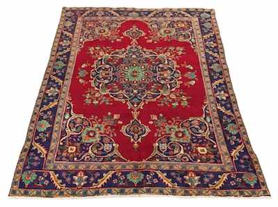 Appraisal: A Tabriz Area Carpet Bright red field with blue medallion