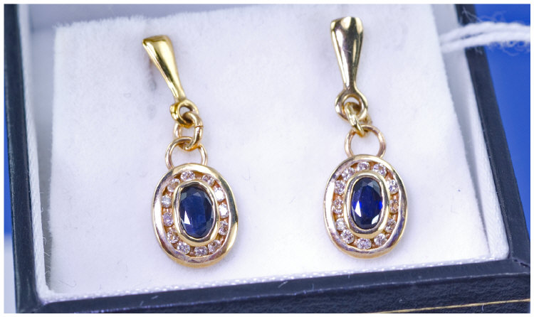 Appraisal: ct Gold Sapphire And Diamond Drop Earrings Central Oval Sapphires