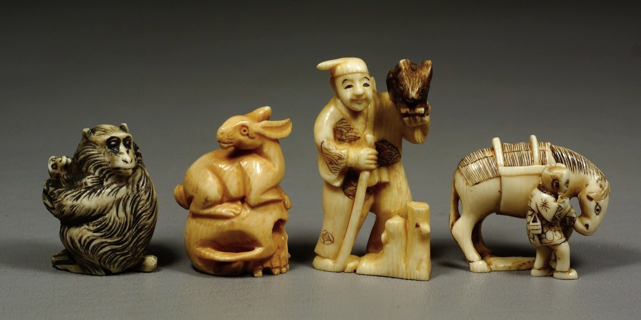 Appraisal: carved ivory Japanese netsuke figures holding horse rabbit monkey rabbit