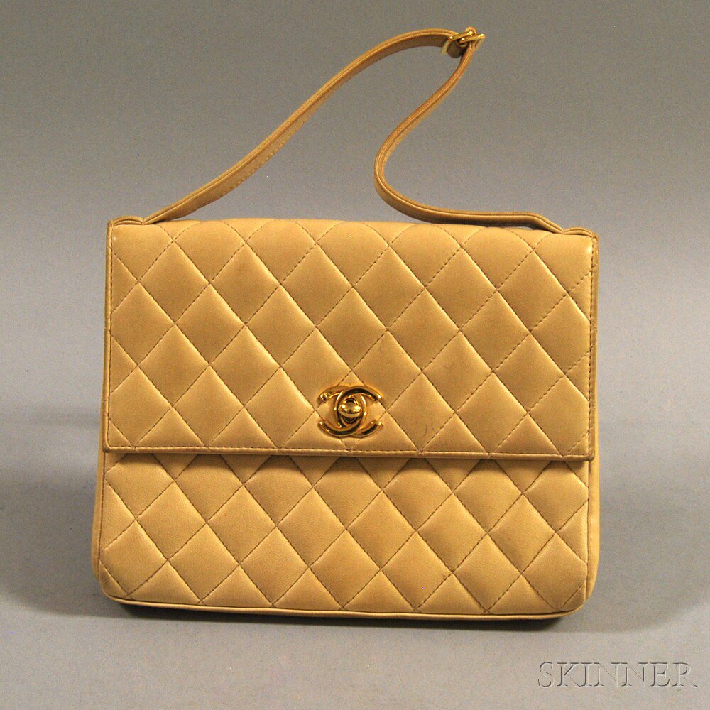 Appraisal: Chanel Camel-tone Quilted Lambskin Clutch with interlocking CC clasp and