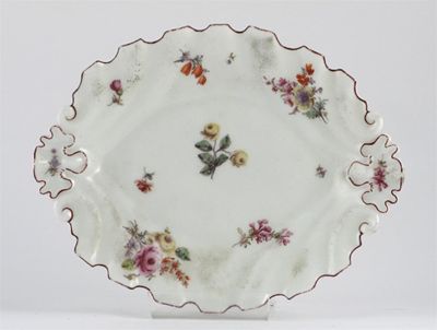 Appraisal: A Chelsea silver-shape dish painted with polychrome flower sprays the