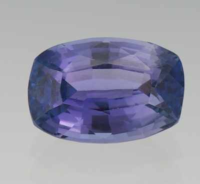 Appraisal: An Unmounted Tanzanite UGL Report Faceted cushion cut weighing carat