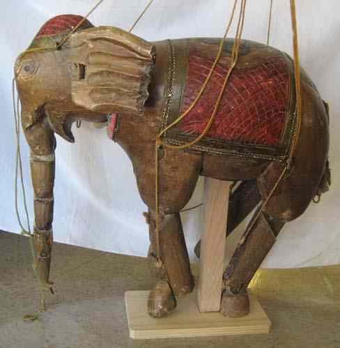 Appraisal: A PAKISTANI CARVED WOOD ELEPHANT PUPPET with strings which raise