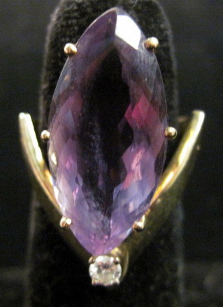 Appraisal: karat yellow gold amethyst and diamond ring Navette shaped amethyst