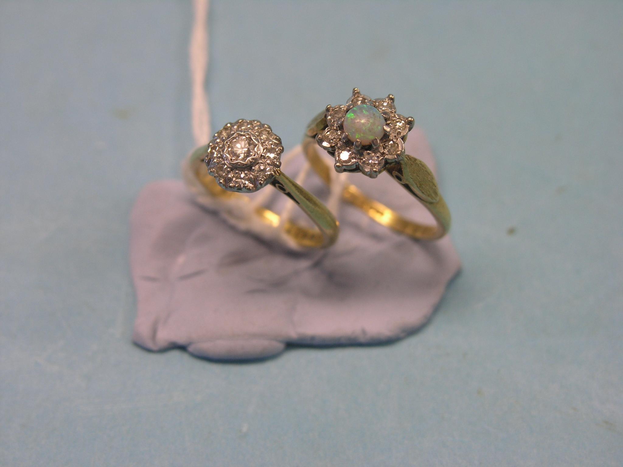 Appraisal: Two ct gold and diamond cluster rings one ring with