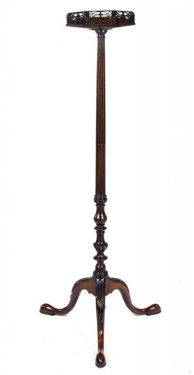 Appraisal: A GEORGE III MAHOGANY TORCHERE the figured octagonal top with